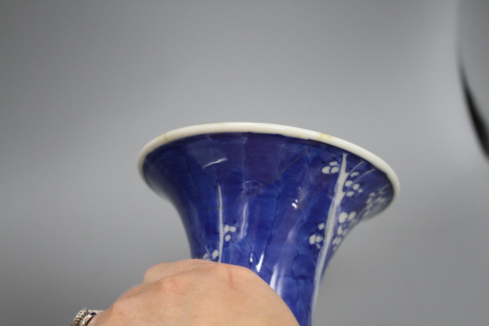 A pair of Japanese blue and white baluster vases, decorated with prunus trees, six character mark, height 31cm
